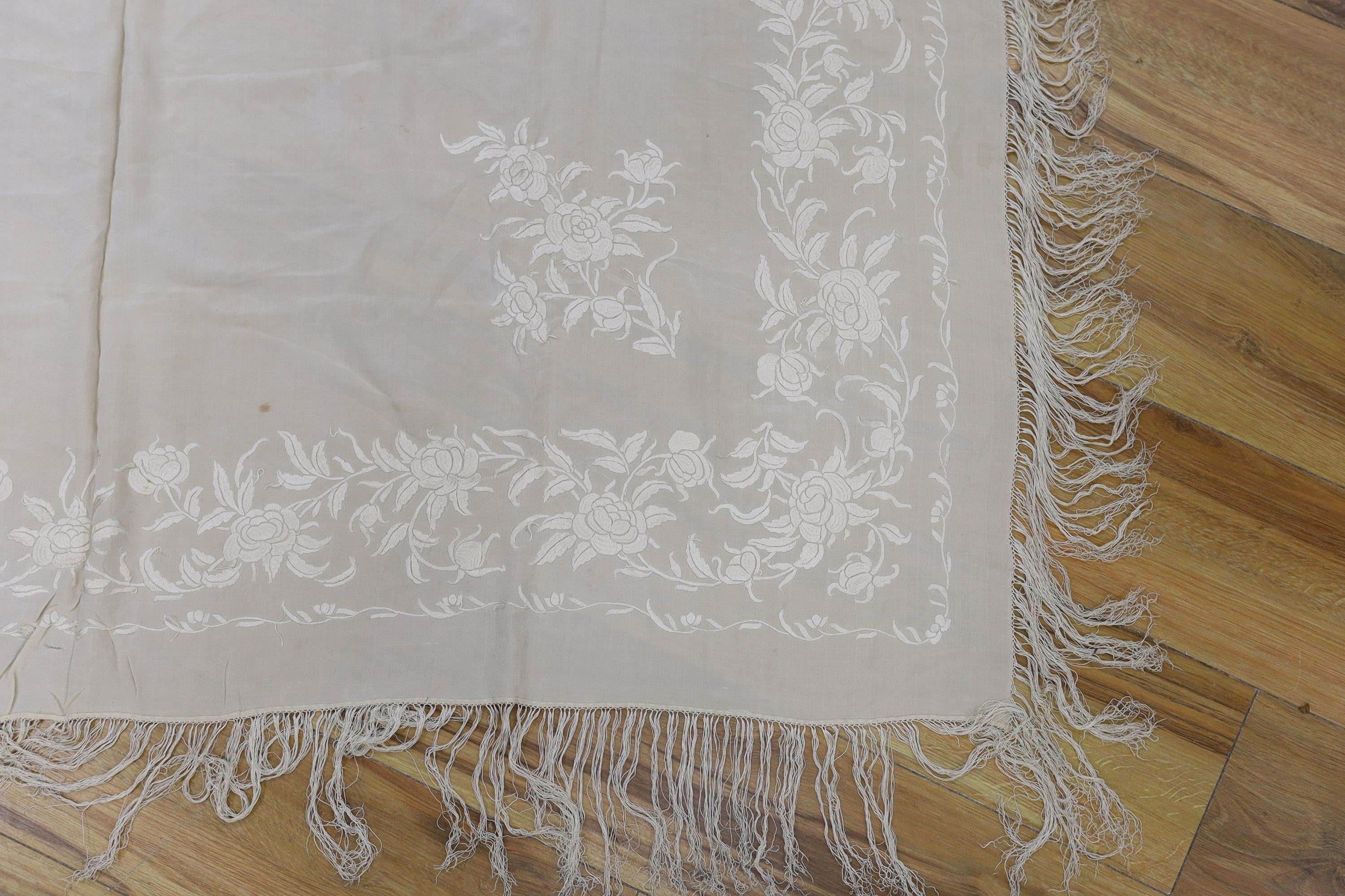 A 19th century cream embroidery on cream silk shawl together with a smaller later shawl